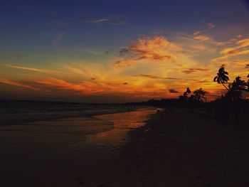 Scenic view of beach against sky during sunset