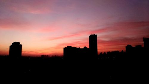 Silhouette of city at sunset