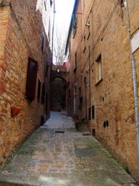 Narrow alley amidst buildings in town