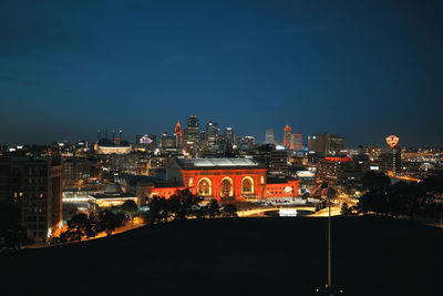 Illuminated buildings in city at night