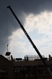 Low angle view of building against cloudy sky