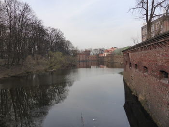 River amidst buildings against sky