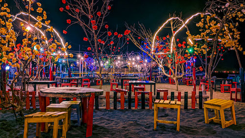 The sparkling lights of a cafe on the beach at night