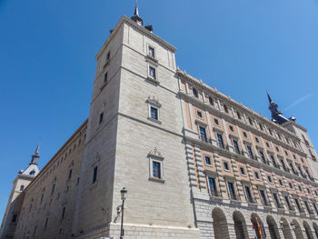 Low angle view of building against clear blue sky