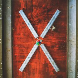 Directly above shot of red metal on wall