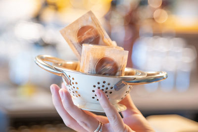 Close-up of hand holding ice cream