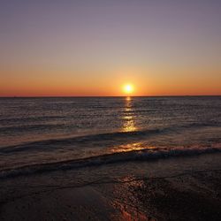 Scenic view of sea against clear sky during sunset