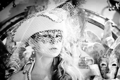 Portrait of young woman wearing eye mask in carnival
