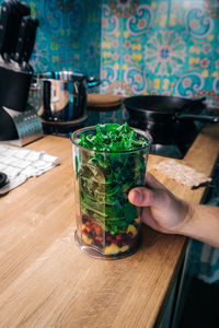 Midsection of person preparing food on table