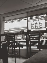 Empty chairs and tables in restaurant