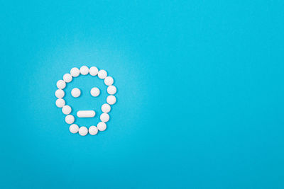 High angle view of blue paint on white background