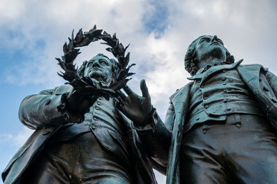 Low angle view of statue against sky