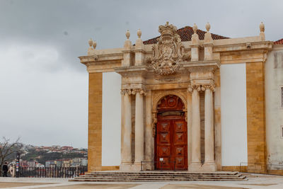 Low angle view of historical joanina library against sky in coimbra