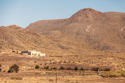 Scenic view of desert against clear sky