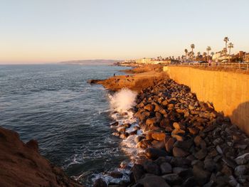 Scenic view of sea against clear sky during sunset