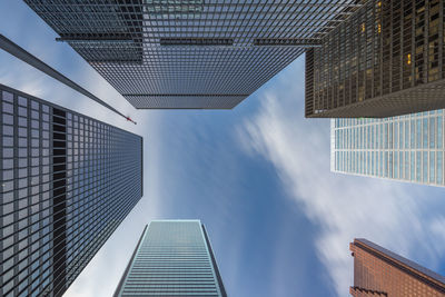 Low angle view of tall buildings against sky