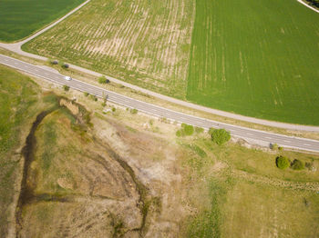 High angle view of road passing through land