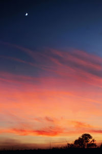 Low angle view of dramatic sky at sunset