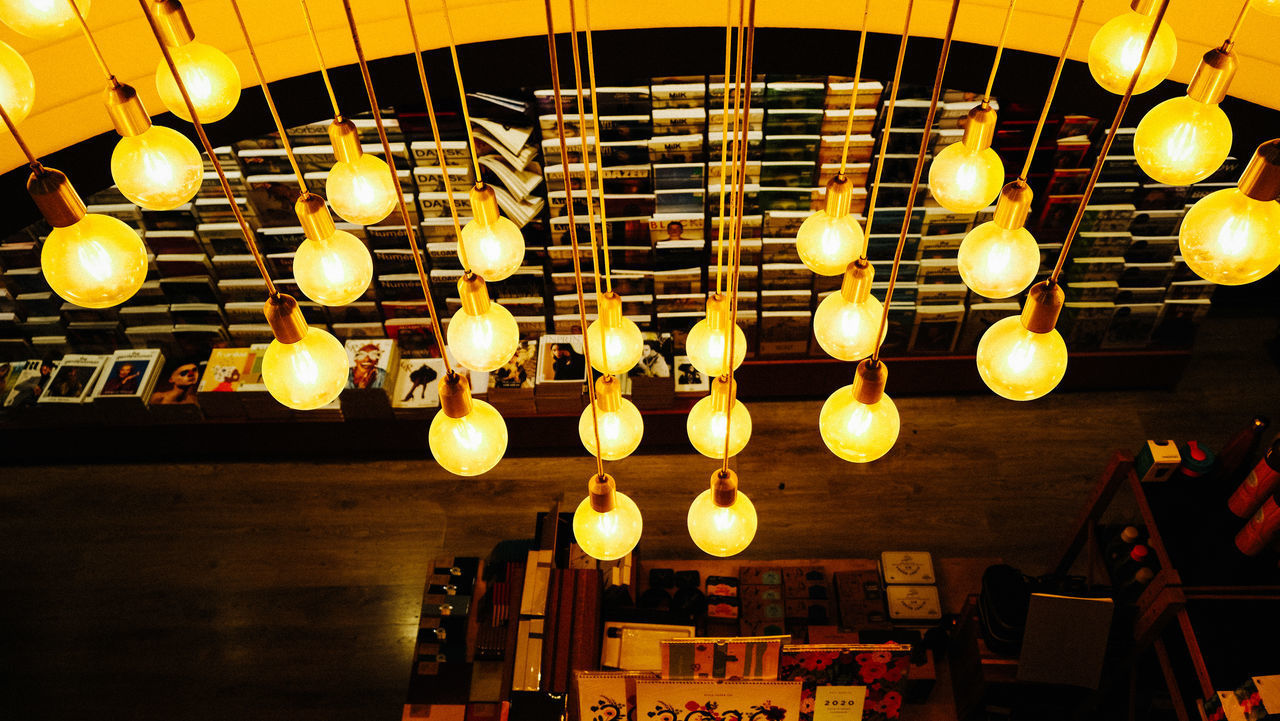 LOW ANGLE VIEW OF ILLUMINATED PENDANT LIGHT