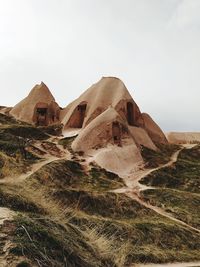 Built structure on desert against clear sky