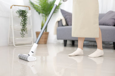 Low section of woman standing on floor