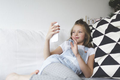 Girl waving hand during video call