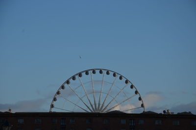 View of ferris wheel against sky