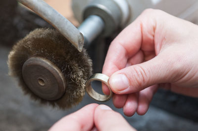 Close-up of hand holding metal