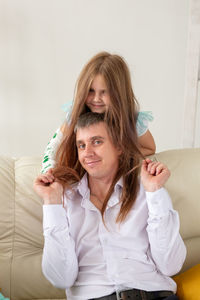 Portrait of smiling woman at home