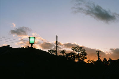 Low angle view of silhouette trees against sky during sunset