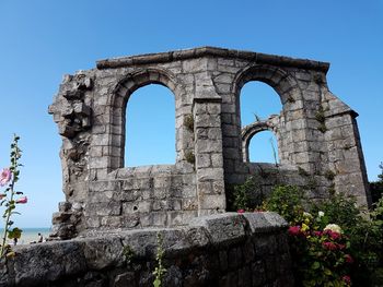 Low angle view of historical building against clear sky