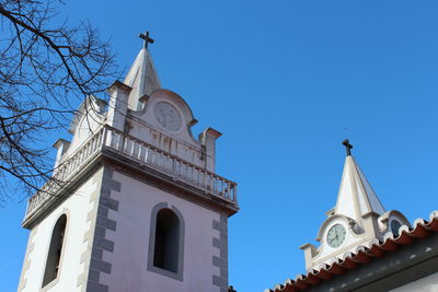 Low angle view of church against clear blue sky