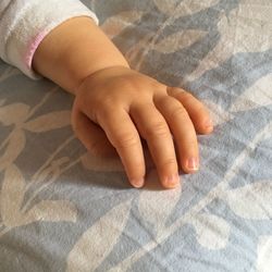 Low section of child on bed