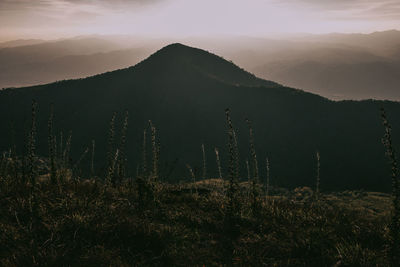 Scenic view of mountains against sky during sunset