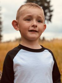 Close-up of boy standing outdoors