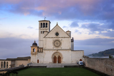 The majestic basilica of san francesco in assisi, italy. photographed from above at dawn