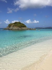 Scenic view of sea against blue sky