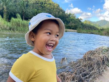 Portrait of smiling boy in lake