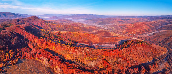 November mountain panorama. mountain autumn misty sunrise landscape. morning valley covered by fog 