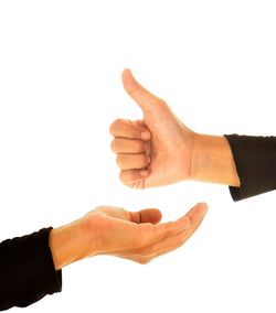 Low angle view of human hand against white background