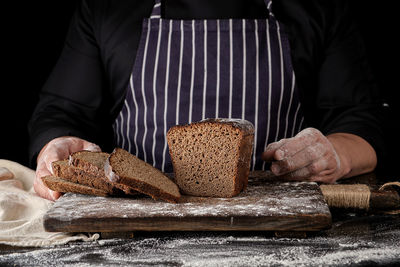 Midsection of man preparing food