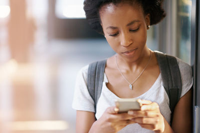 Young woman using mobile phone