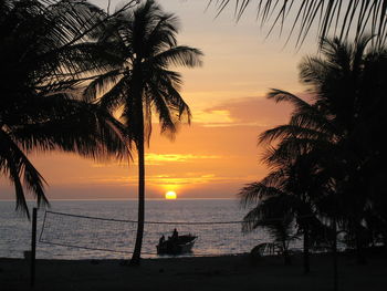 Scenic view of beach at sunset