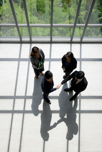 High angle view of two people standing on floor