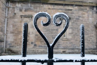 Close-up of snow on brick wall