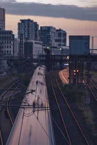 High angle view of railroad tracks amidst buildings in city