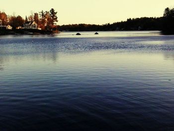 Scenic view of lake at sunset