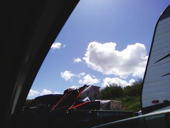 View of cloudy sky seen through car window