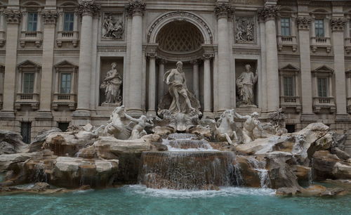 Fountain in front of historical building