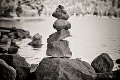 Close-up of stack of rocks against sky